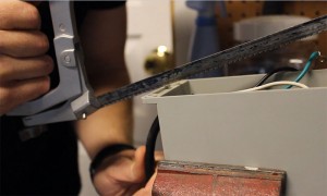Cutting Out Power Cord With Hacksaw