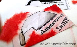 Ink, Watercolors and red mulberry paper to make a logo.